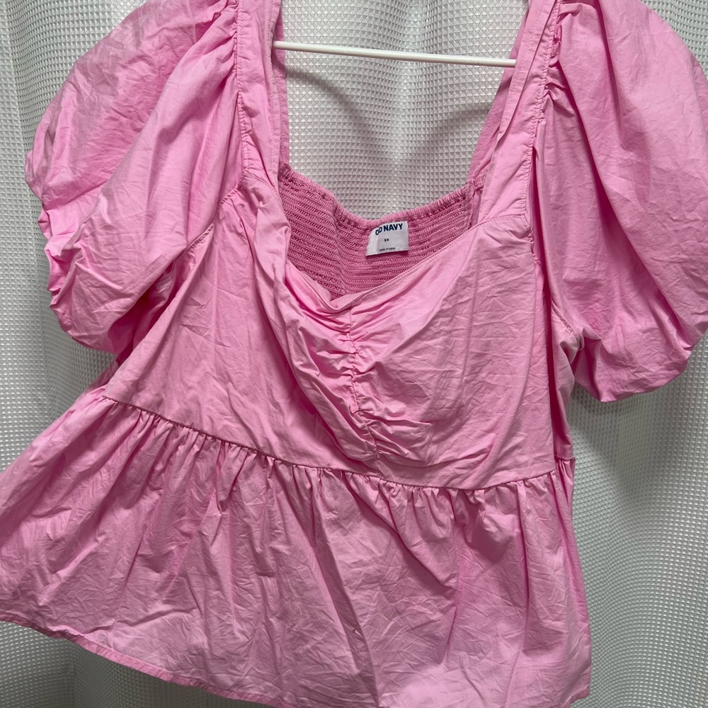 Pink peplum top with puffy sleeves